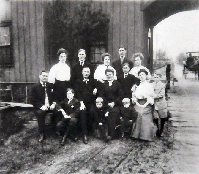‘Rieder Family Tollhouse, Saginaw and Genesee Plank Road Company,’ from a 1907 Goodridge Brothers Studio photograph. The plank road can be seen in the right corner of the photograph.